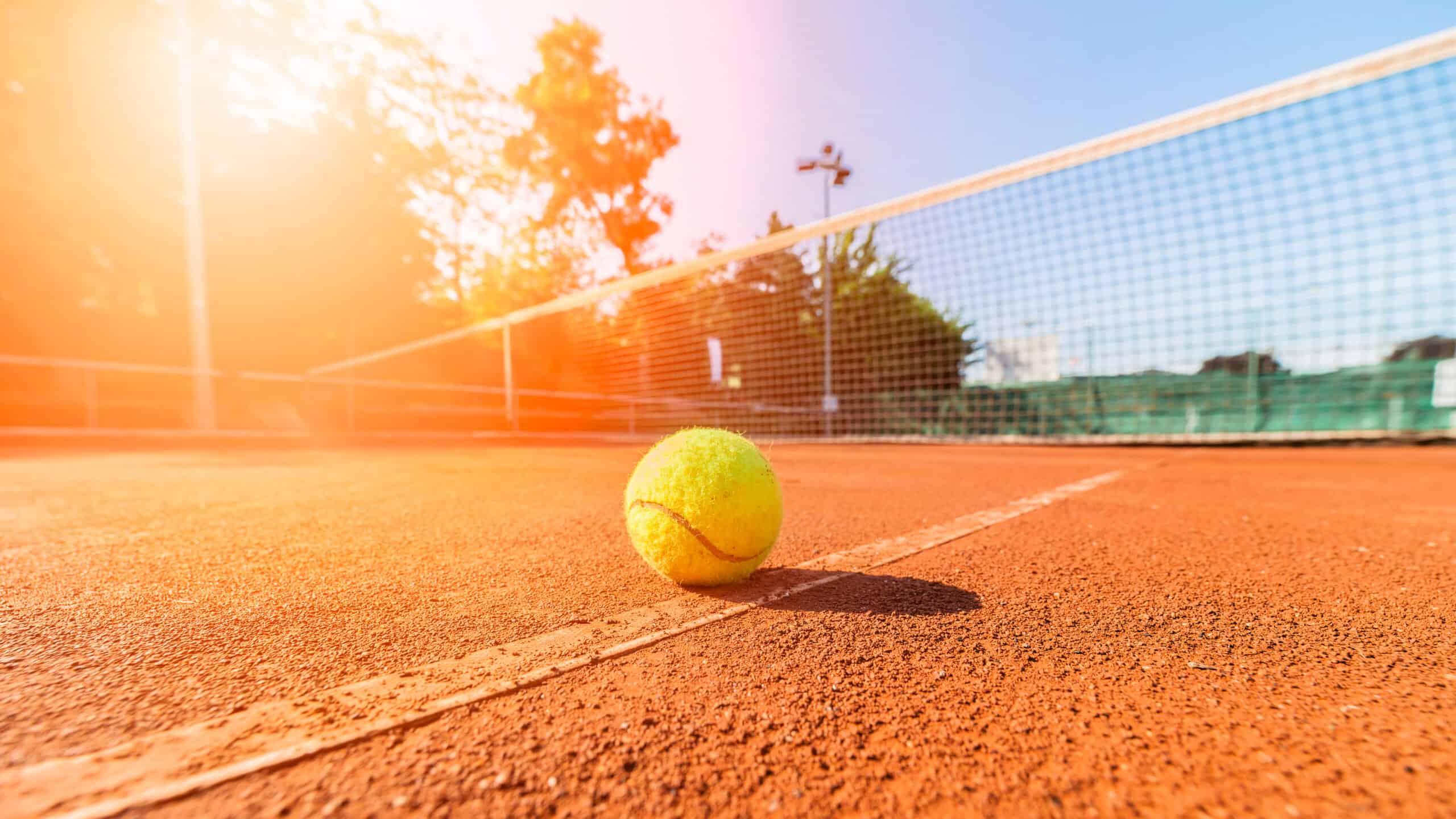 tennis ball on clay court