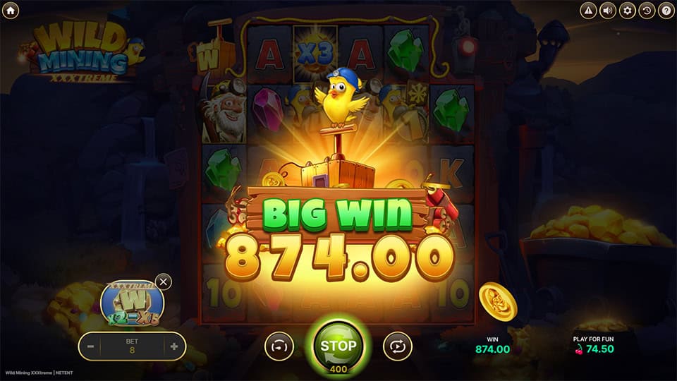 Big win screen in Wild Mining XXXtreme slot displaying a €874 payout.