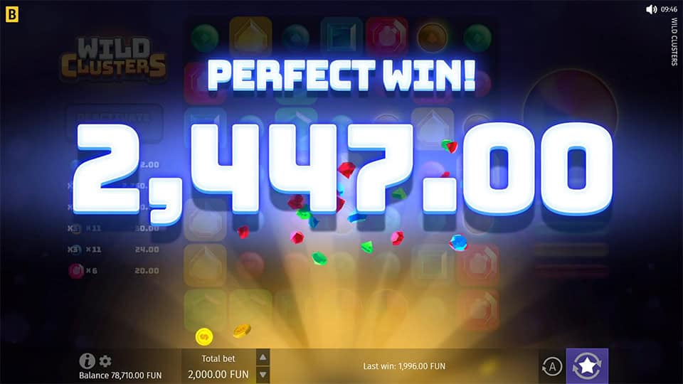 A massive win of 2,447 displayed in Wild Clusters with glowing effects and scattered gem symbols.